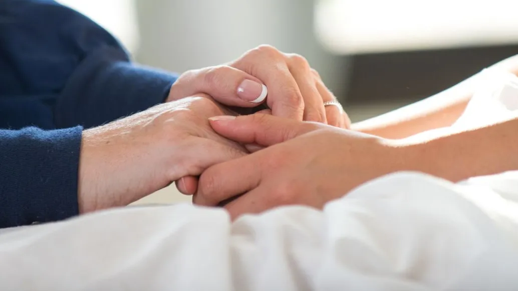 two people holding hands.