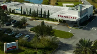 A render of AdventHealth Lake Mary ER and its parking lot