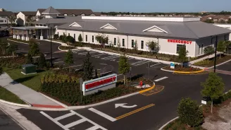 A view of AdventHealth Palm Parkway and its parking lot
