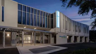 Adventhealth New Tampa building exterior at dusk