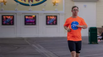 Chris Nikic running at Disney's Boardwalk Resort.