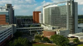 A photo of AdventHealth Orlando, shining in the sunlight.