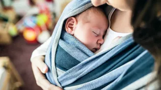 Woman holding infant