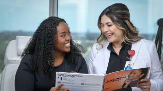 A woman talking to a provider about skin care.