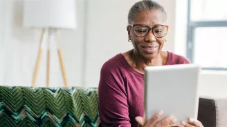 Woman reading tablet