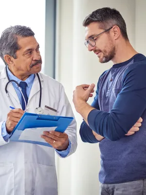 Adult White Man Discusses His Condition With A Doctor