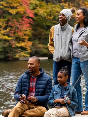 Family fishing by the lake in the Fall.