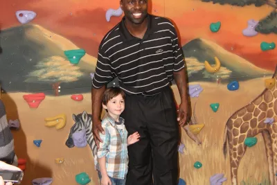 Darrell Armstrong with a kid