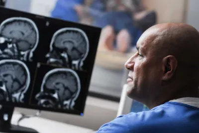 A nurse technician in front of a computer