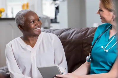 A woman reviews her test results with her doctor.