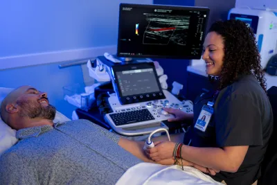 A male patient receiving an arm ultrasound.