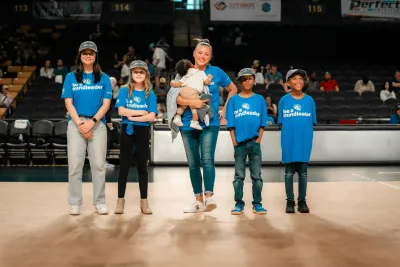 Orlando Valkyries fans standing on the court