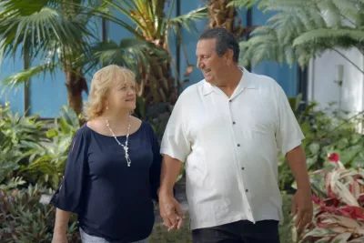 Susan and her husband walking together.