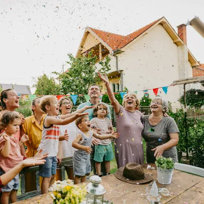Group of people celebrating together outdoors.