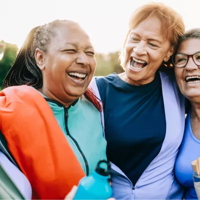A Group of Senior Women Take a Break From a Run to Share a Laugh