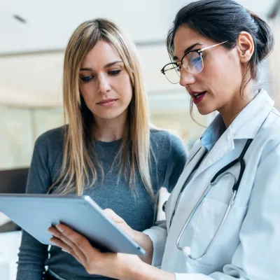 A Doctor Goes Over a Chart with a Patient