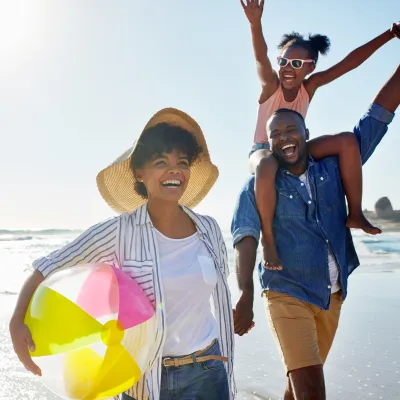 A healthy family enjoys a summer day on the beach.