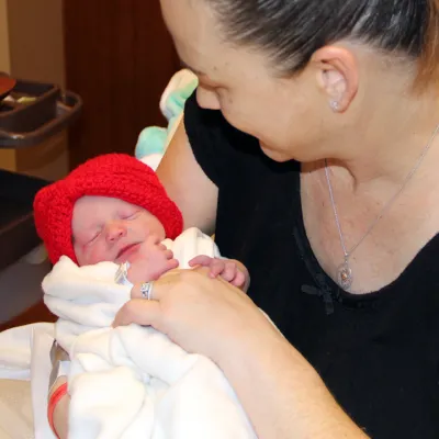 Baby Lexi with red hat for News