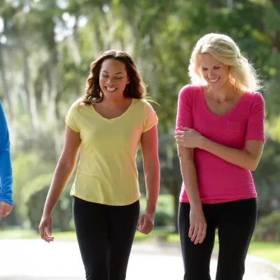 Two women walking outdoors.