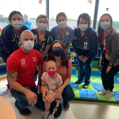 daniel webb with his daughter and staff at adventhealth for children