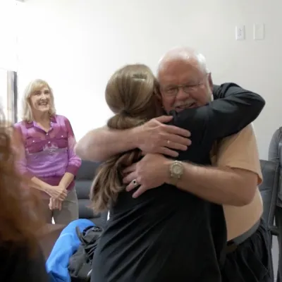 Robert hugs one of the nurses who cared for him during treatment.