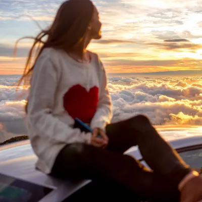 A woman celebrates a healthy heart.