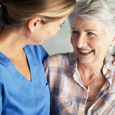 Woman comforted by medical professional