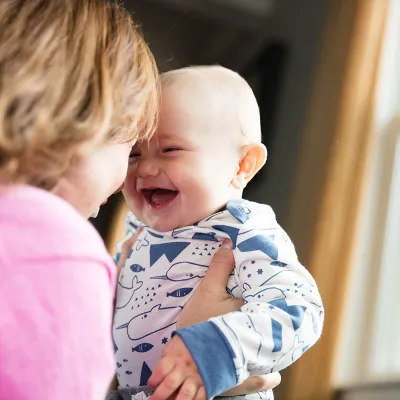 Baby laughing with Mama.