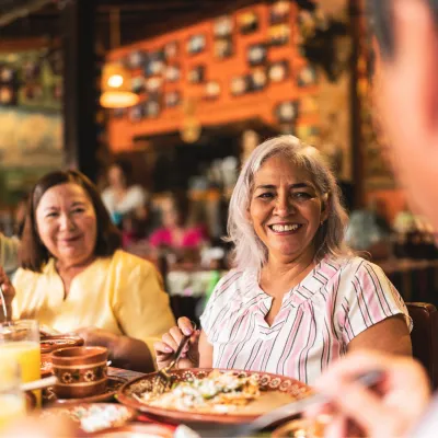 A group of adults having dinner at a restaurant.