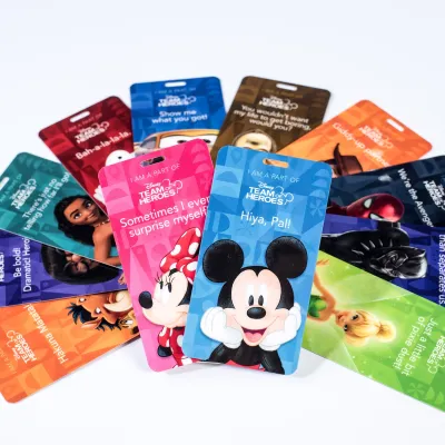 Multicolored Disney Team of Heroes badges. 