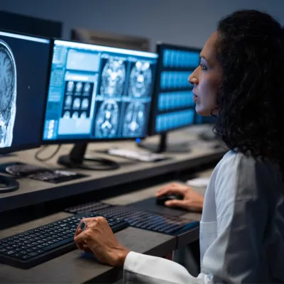 Doctor looking at a brain CT scan.
