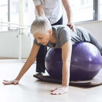 woman exercising with a fitness trainer
