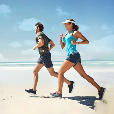 Couple running on the beach