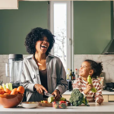 Woman cooking with her child