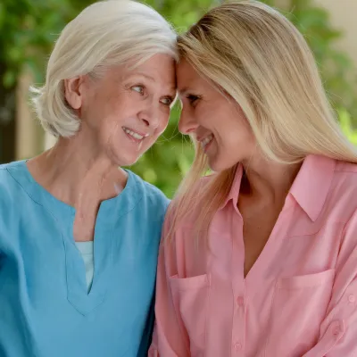 An adult daughter and mother spend time together.