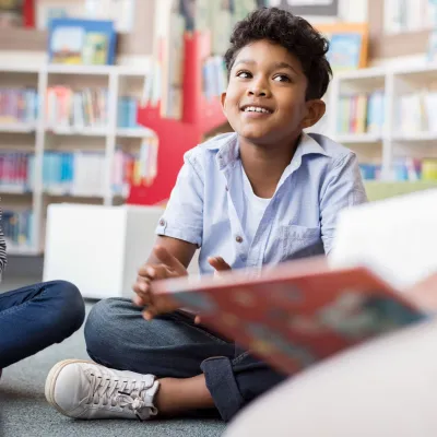 A child enjoying a story in the classroom.
