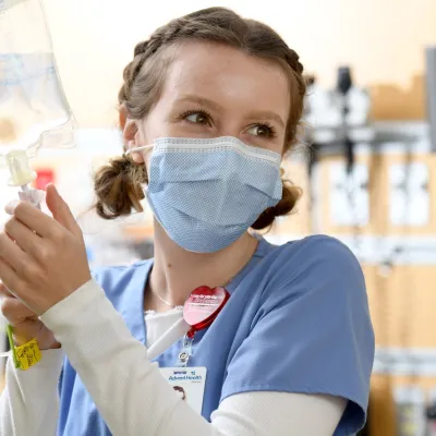 An AdventHealth team member starts an IV.