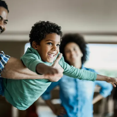 A mother and father spending time with their son