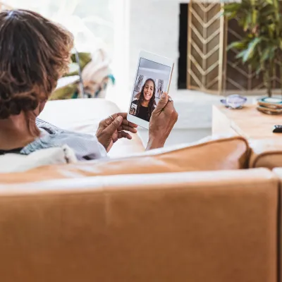 A grandmother talking to her granddaughter virtually