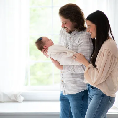 The Trapp family with their newborn daughter