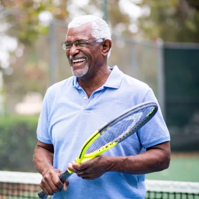 An older gentleman on the tennis court