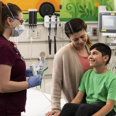 A young boy in a pediatric visit with his mother.