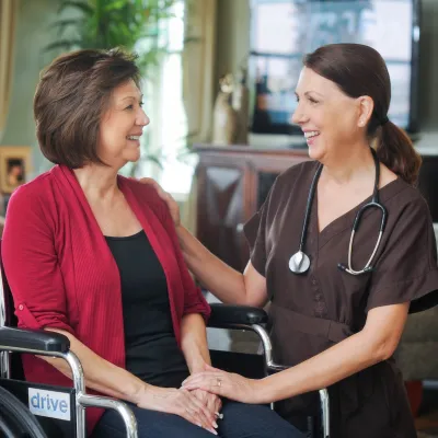 home health nurse with patient