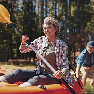 woman-in-a-kayak-and-smiling