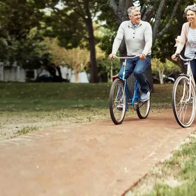 Old Couple Riding Bikes