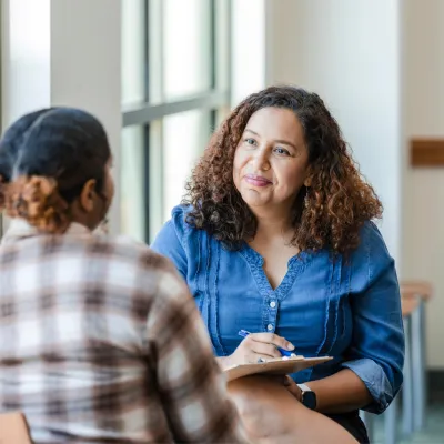Two women having a conversation about mental health.
