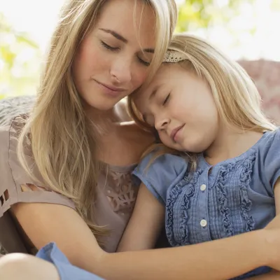 A mother comforting her daughter.