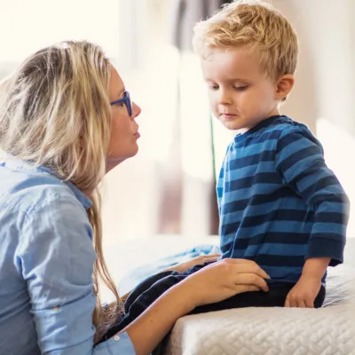 A mother talking with her son.