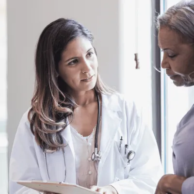 Older woman speaking to her healthcare provider
