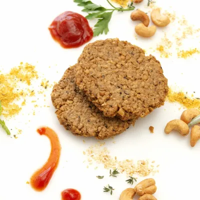 Two homemade cashew and oat-based patties